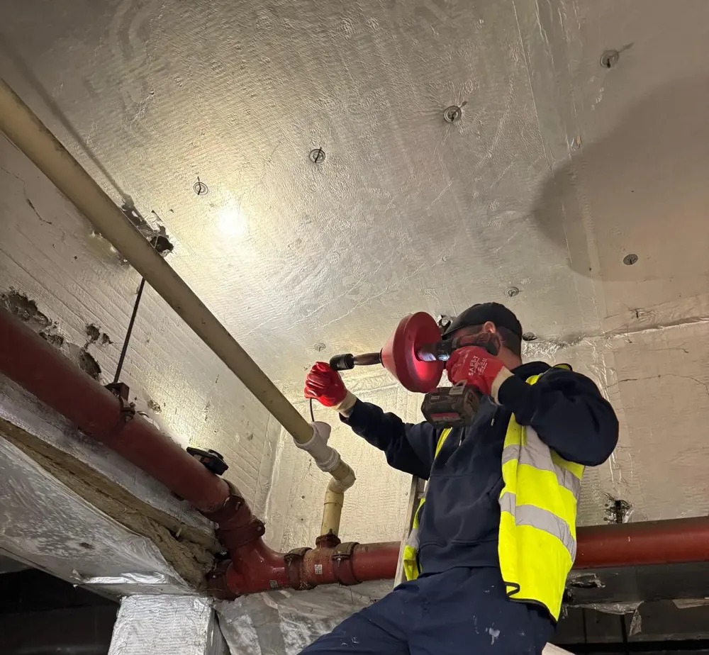 Engineer working on drain pipe