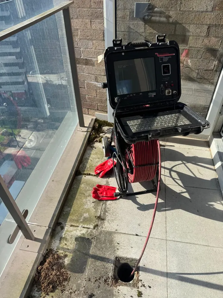 Drain camera monitor on a balcony job